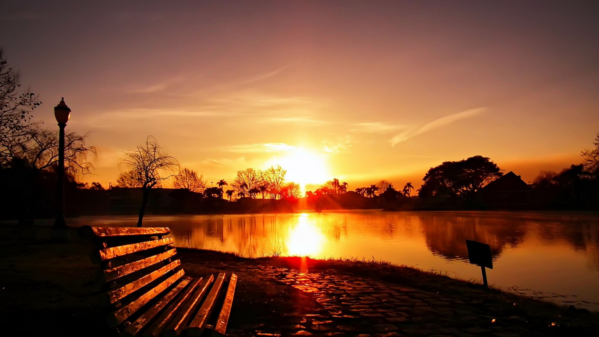 nature_landscapes_lakes_water_reflection_color_bright_sunrise_sunset_sky_clouds_sunlight_shore_seat_chair_bench_lamp_post_trees_park_garden_1920x1080